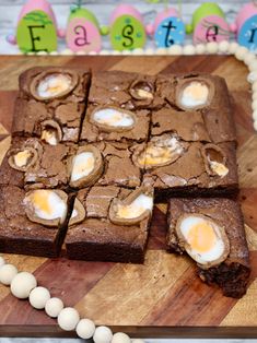 there are brownies with eggs in them on the cutting board