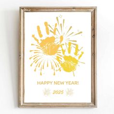 a happy new year card with yellow handprints on the front and back of it