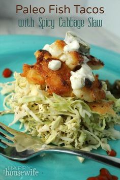 a blue plate topped with food and a fork