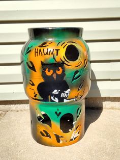 there is a large vase painted with cats on it