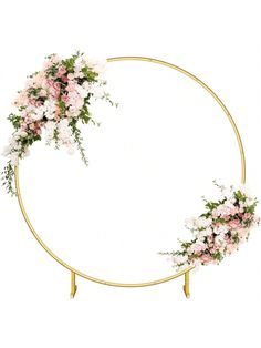 a circular gold frame with pink and white flowers