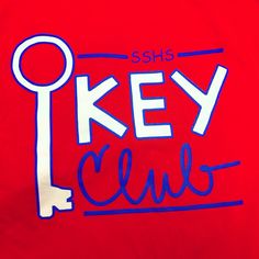 there is a red shirt with the words key club written in blue ink on it