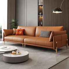 a modern living room with brown leather furniture and large windows overlooking the cityscape