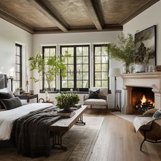 a bedroom with a bed, fireplace and two windows