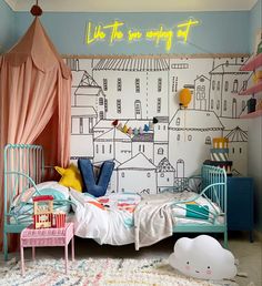 a child's bedroom decorated in pastel colors