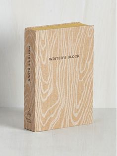 a wooden block with the words writer's block written on it