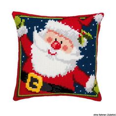 a cross stitch christmas pillow with santa claus on it's chest and the number 3