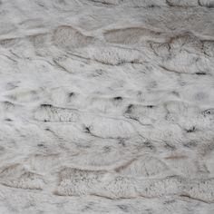 an animal fur texture is shown in this close up photo, it appears to be white or gray