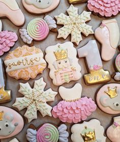 some decorated cookies are laying on a table