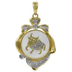 Wonderful Taurus charm. 18K yellow gold frame; clear glass center, with a diamond-encrusted bull that spins around as you move. 1" x 3/4." For the Taurus in your life! Alice Kwartler has sold the finest antique gold and diamond jewelry and silver for over forty years. Drusy Jewelry, Chanel Art, Jewelry Pendants, Gold Charms, Diamond Charm, Diamond Gold, Diamond Jewellery, Gold Charm, Gold Frame