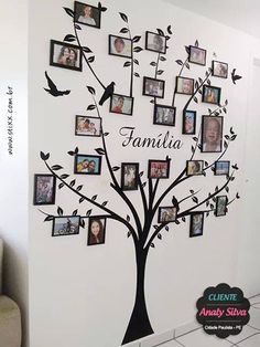 the family tree wall decal is decorated with many photos and has birds flying around it