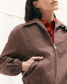 In a rich hue and with chic seam detailing, this classic bomber jacket is the cherry-on-top of any fall look. Cut from a luxe, medium-weight cotton twill, Lev is the perfect addition to your seasonal transition wardrobe. See below for our general Size Guide and available measurements Made of 100% cotton Machine wash cold and lay flat to dry Chic Brown Cotton Outerwear, Fall Cotton Outerwear With Zip Cuffs, Fall Outerwear With Elastic Cuffs And Relaxed Fit, Spring Utility Jacket With Zipper For Work, Trendy Outerwear With Zip Cuffs For Work, Relaxed Fit Fall Outerwear With Zip Cuffs, Classic Spring Outerwear With Zip Cuffs, Everyday Solid Utility Jacket, Chic Outerwear For Work With Ribbed Cuffs