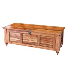 a large wooden trunk sitting on top of a table