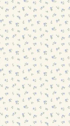 a white and blue flowered wallpaper with small purple flowers on the left side