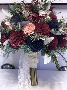 a bouquet of red, white and blue flowers