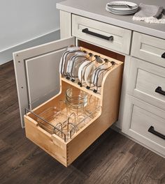 an open dishwasher drawer in a kitchen