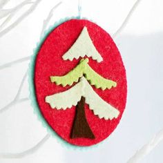 a felt ornament with a christmas tree on it