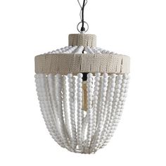 a white chandelier hanging from the ceiling with beaded strands and wooden beads