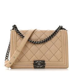 This is an authentic CHANEL Calfskin Quilted Double Stitch New Medium Boy Flap in Beige. This chic shoulder bag is crafted of rich beige colored diamond stitched calf leather. The bag features a rutheniumsilver chain shoulder strap with a leather shoulder pad and a ruthenium Boy push lock. This opens the front flap to a greyfabric interior with zipper and patch pockets. Chanel Gst Beige, Double Stitch, Diamond Stitch, New Media, Grey Fabric, Shoulder Pads, Patch Pocket, Colored Diamonds, Calf Leather