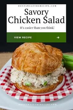 a chicken salad sandwich on a plate with celery