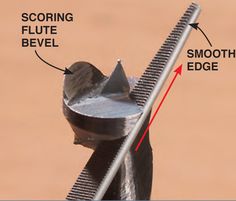 a close up of a metal object with an arrow pointing to it