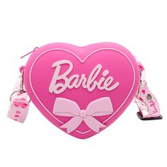 a pink heart shaped purse with a bow on the front and name barbie written on it