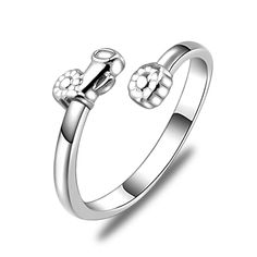 a white gold ring with two skulls on the front and one skull on the back