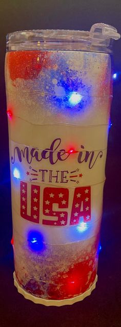 a plastic cup that has some lights on it in the shape of an american flag