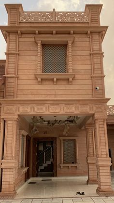 the front entrance to a building with an open door