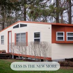 a mobile home with the words less is the new more