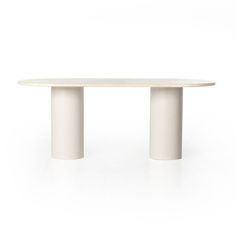 an oval white table with two columns on the top and one column at the base