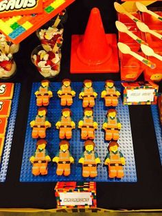 a table with legos and toys on it for children's birthday or baby shower