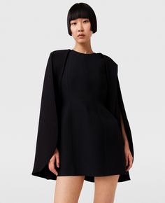 Women Pitch black Round Neck Cape Mini Dress | Stella McCartney US Structured Mini Dress For Fall Evening, Structured Mini Dress For Evening In Fall, Black Structured Dress For Fall, Black Structured Fall Dress, Black A-line Midi Dress In Elastane, Black Spring Dresses With Structured Shoulders, Spring Black Dresses With Structured Shoulders, Black Dresses With Structured Shoulders For Spring, Black Dress With Structured Shoulders For Fall