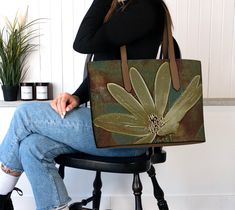 Introducing a beautiful collection of vegan leather tote bags featuring wildflowers from original photographs, digitally re-mastered in a moody Old Masters style. These totes are stylish and functional, Perfect for school, vacation, or business days.  **NOTE** The video features a black handle version from my private collection. 🌸 Matching Makeup/Evening Bag: https://www.etsy.com/ca/listing/1730750120/artsy-bohemian-makeup-bag-vegan-leather?click_key=96d44c2b26aa993ec87ba4202b52c8003b6cf462%3A1 Green Nature-inspired Bag For Everyday Use, Nature-inspired Green Bags For Everyday Use, Bohemian Makeup, Matching Makeup, Romantic Aesthetic, School Vacation, Vegan Leather Tote Bag, Boho Tote, Everyday Purse