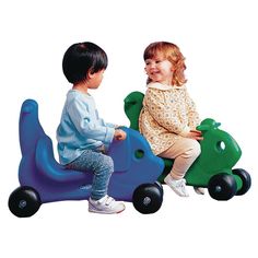 two children are playing on a toy car