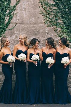 a group of women standing next to each other