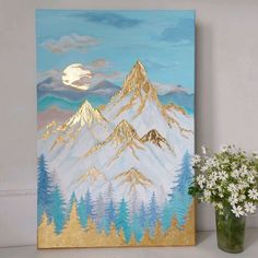 a vase with flowers and a painting on the wall in front of it that has a mountain scene painted on it