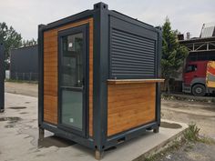 a small building made out of shipping containers