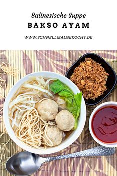 a bowl filled with meatballs and noodles next to two bowls of dipping sauces