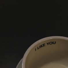 an empty coffee cup with the words i like you written on it