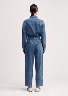 Denim Jumpsuit + Belt Mid Blue Denim Utility Denim Jumpsuit For Fall Workwear, Utility Button-up Denim Jumpsuit, Fall Workwear Denim Button-up Jumpsuit, Fall Utility Denim Jumpsuit For Workwear, Spring Denim Jumpsuit With Buttoned Pockets For Work, Fall Denim Jumpsuit With Button Closure For Work, Denim Workwear Jumpsuit With Buttoned Pockets, Relaxed Fit Denim Jumpsuit With Buttons For Work, Utility Denim Jumpsuit For Workwear