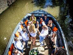 a group of people riding on the back of a boat