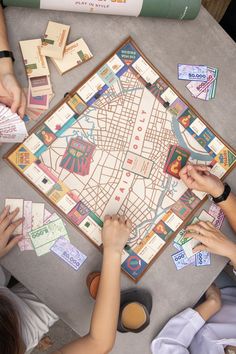 several people playing a board game on a table