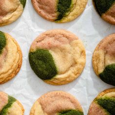 several cookies with green and pink frosting on them