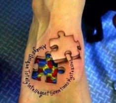 a person with a tattoo on their foot has a puzzle piece and the words i love you