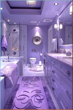 the bathroom is decorated in purple and white