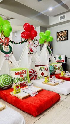 a christmas themed table with balloons and decorations