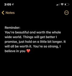 the text on the phone says, reminder you're beautiful and worth the whole wide world