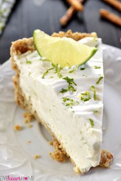 a slice of key lime pie on a white plate