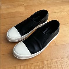 Selling A Very Gently Used Pair Of Rick Owen’s Slip On Leather Sneakers In Size Men’s 13. Bought These Brand New Last Year And Wore Them Twice. Just Recently Professionally Serviced/Cleaned. No Box. Black Calf Leather Sneakers With Contrasting Heel, Black Leather Sole Sneakers For Work, Black Work Sneakers With Leather Sole, Black Workwear Sneakers With Leather Sole, Black Leather Sneakers For Workwear, Black Leather Sole Work Sneakers, Modern Black Sneakers For Work, Luxury Slip-on Men's Shoes With Goodyear Welt, Rick Owen Shoe